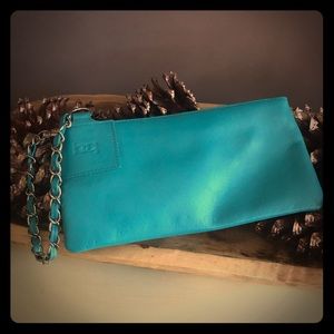 Bebe turquoise wristlet with silver chain detail